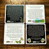 Sweet-Ass Affirmation cards with text and graphics on a wooden surface