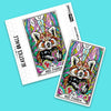Red Panda oracle card sticker with vibrant multicolored geometric background displayed alongside its packaging on bright turquoise surface.
