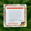 A motivational card from the deck featuring floral borders and an elephant illustration, with an inspirational quote about anxiety and joy, displayed on lush green leaves.