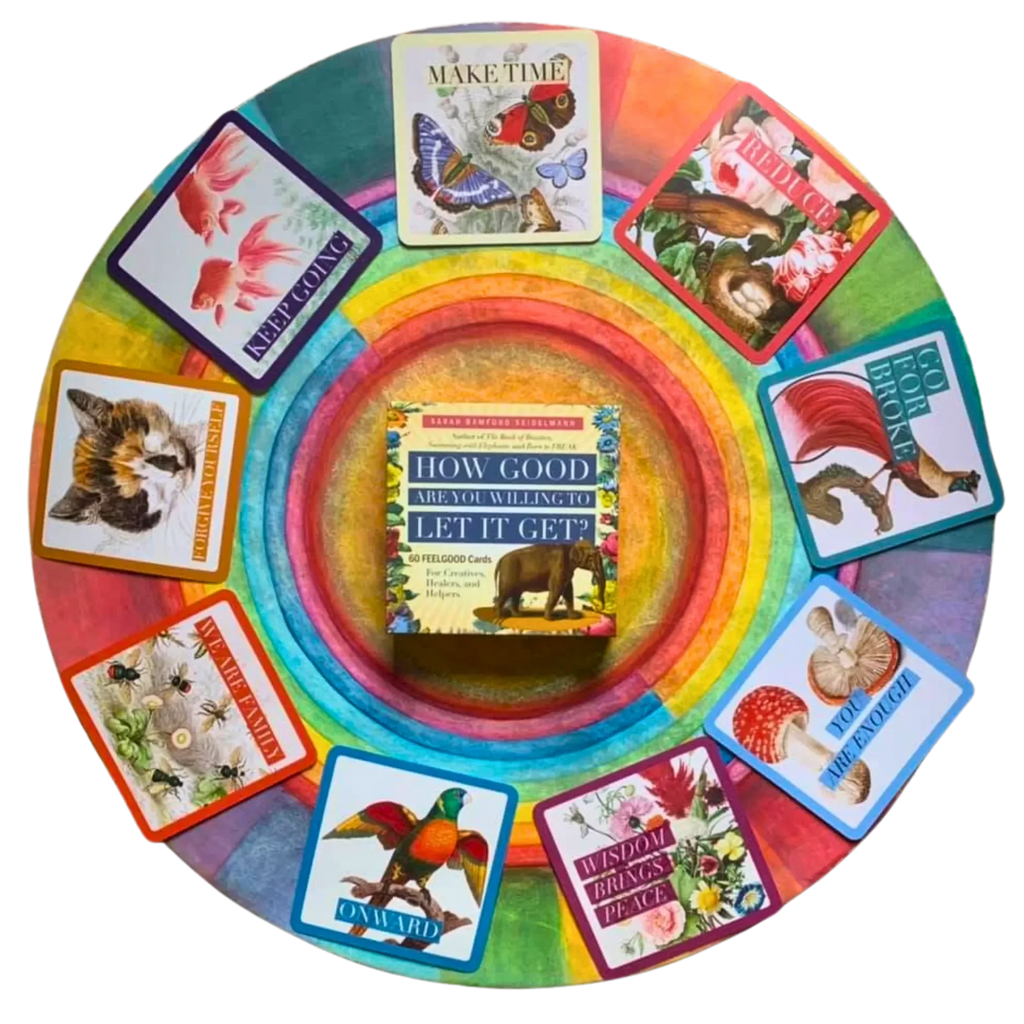 Circular rainbow-colored wheel displays the How Good Are You Willing to Let It Get card deck in the center, surrounded by twelve colorful affirmation cards featuring butterflies, birds, flowers, and n