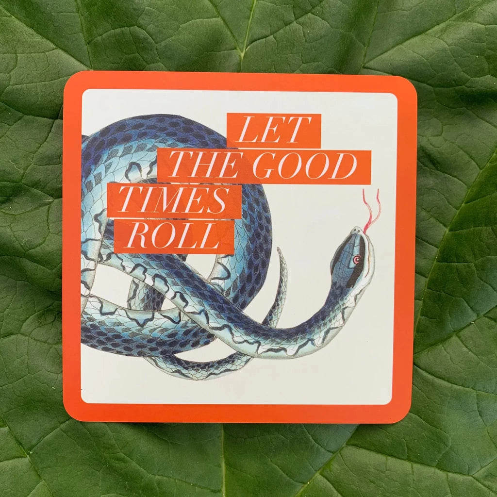Affirmation card with an illustration of a coiled blue and teal snake on cream background, framed in bright orange border with italic text reading 'Let the Good Times Roll' overlaid on the design, pho