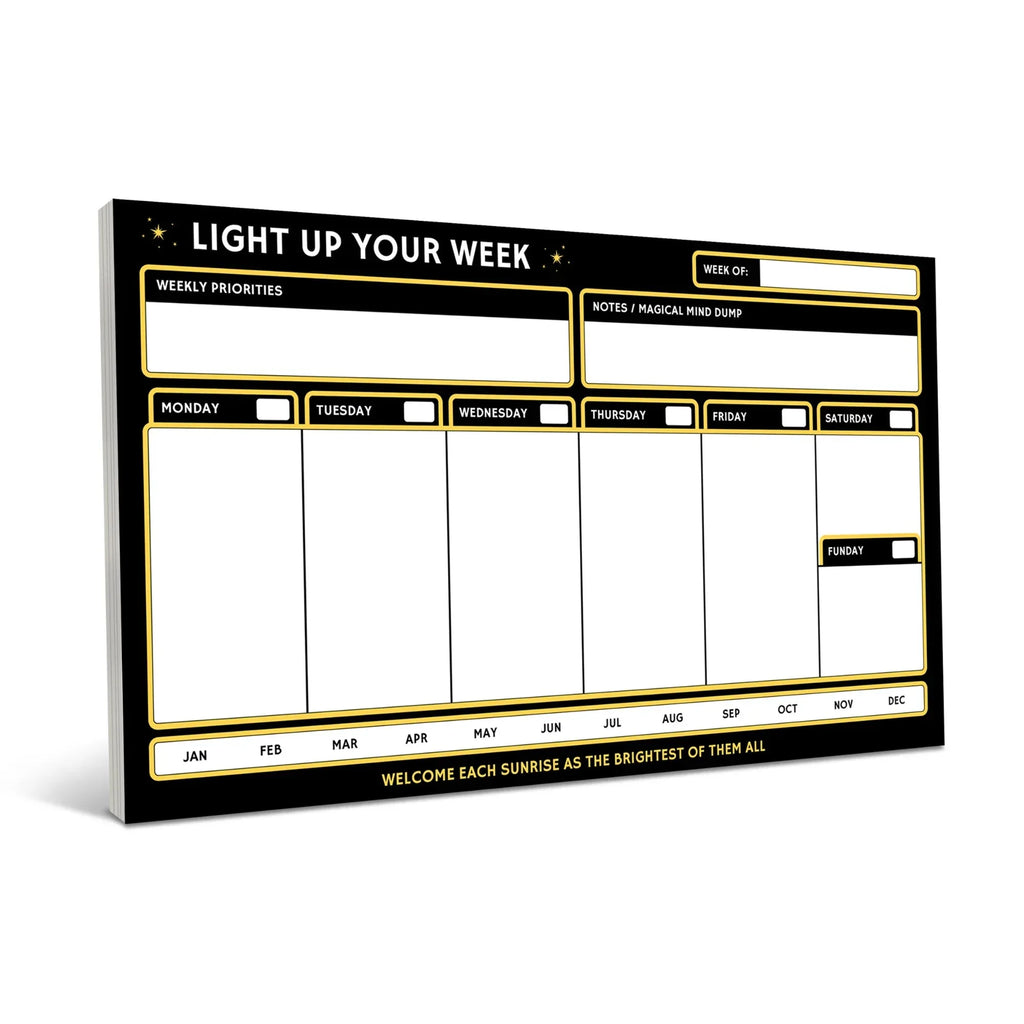 Black weekly planner notepad with gold borders featuring sections for daily schedules Monday through Sunday, weekly priorities, and a notes area, displayed at an angled perspective against a white bac