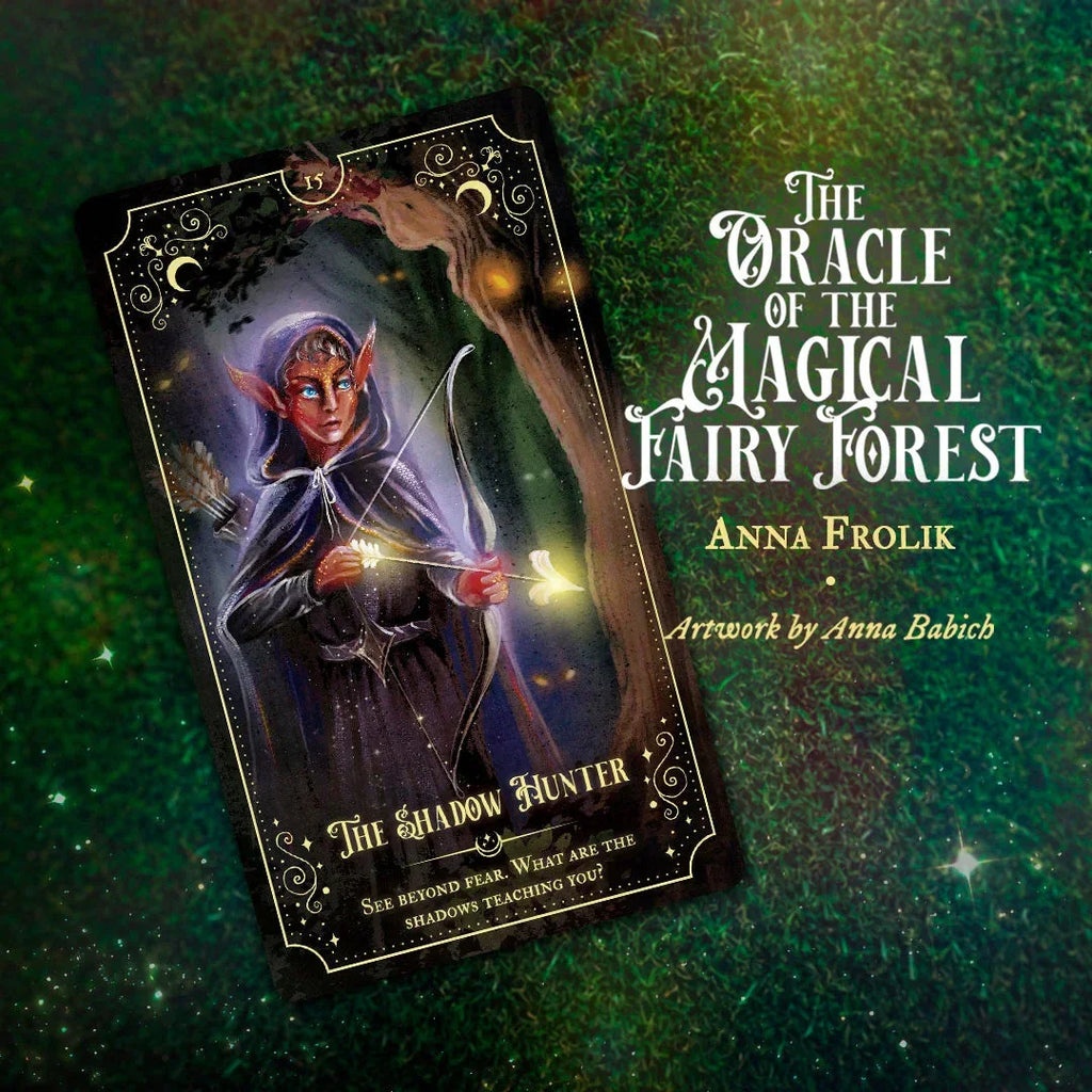 Tarot card from The Oracle of the Magical Fairy Forest showing a red-skinned elf shadow hunter with glowing magical wand against dark mystical background, displayed on a shimmering green moss texture