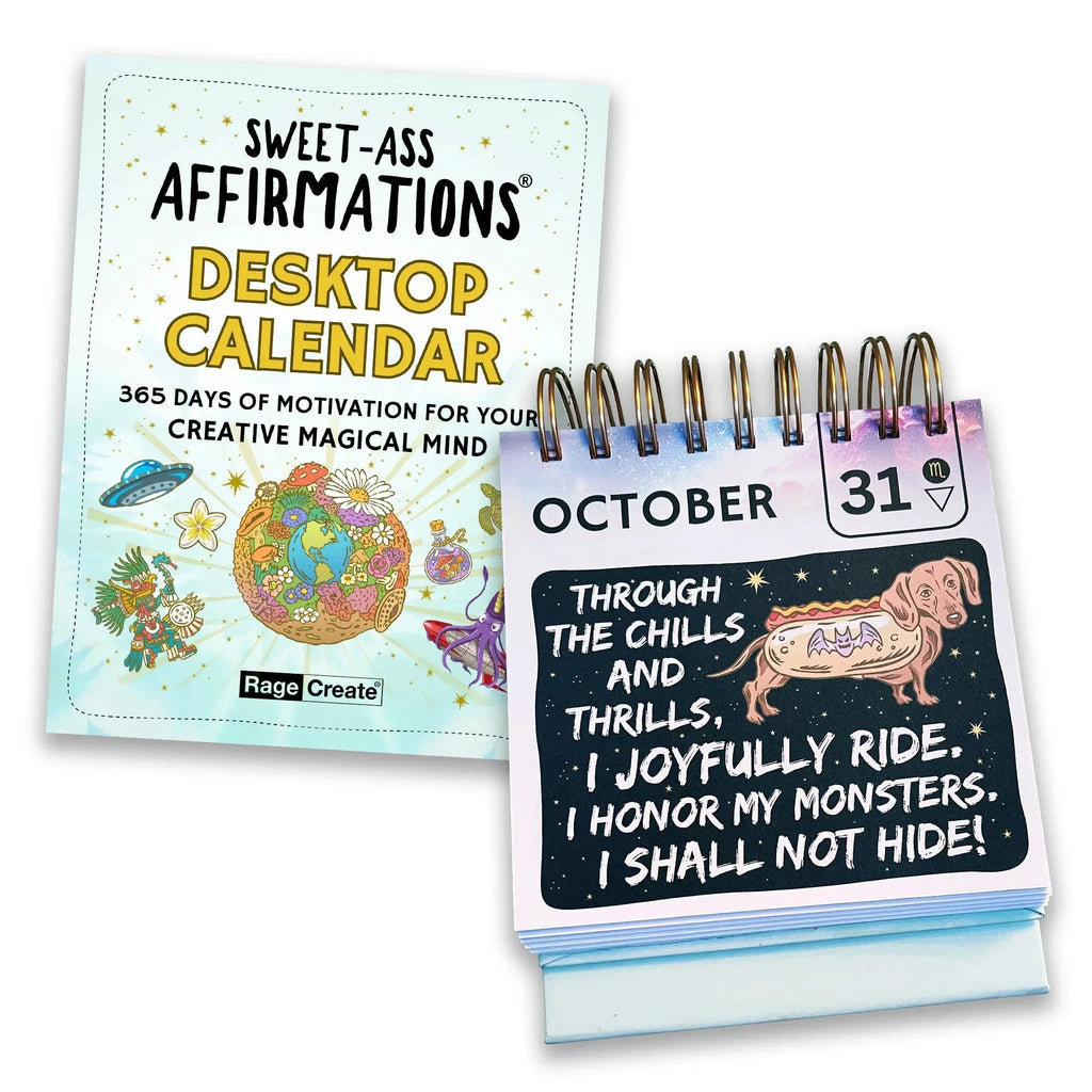 Light blue-covered Sweet-Ass Affirmations desktop calendar open to October, displaying a whimsical affirmation card with a dachshund illustration and motivational text about honoring one's inner monst